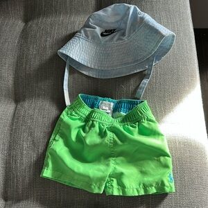 Ralph Lauren swim shorts size 9 months and Nike sun hat size “toddler”
